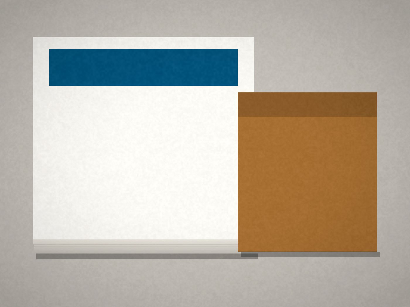 Close-up of stacked flyers with a color band and a kraft carton, no people or text